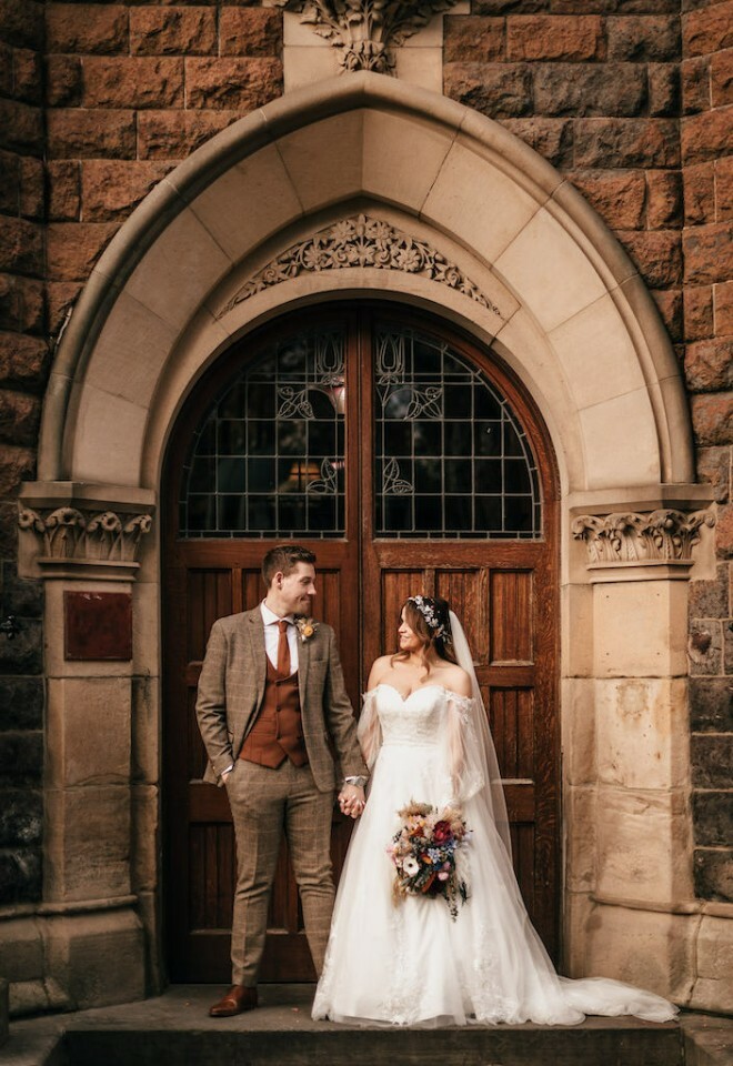 Couples at the front doors of the venue