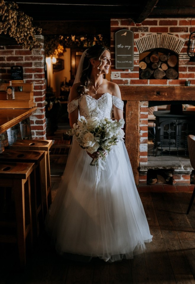 Bride walks through The Harty Estates 16th century private pub