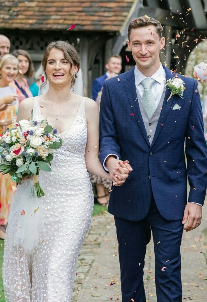 Bride and groom walking holding hands