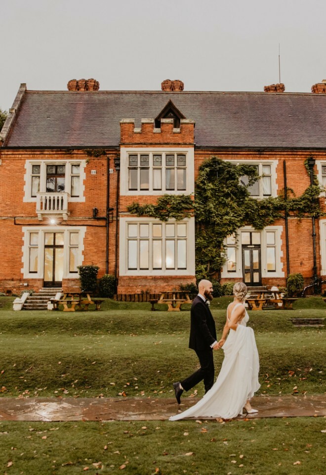 Couple walking in front of venue