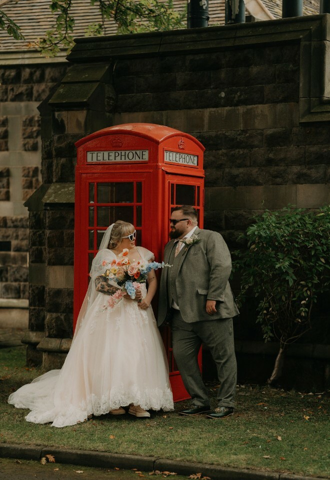 Couple by phone box