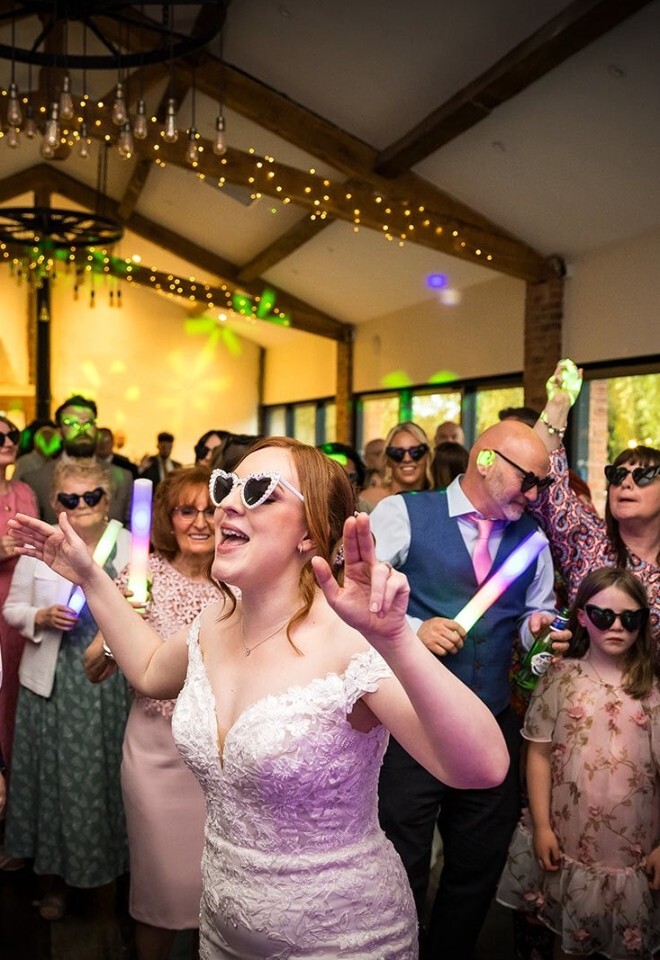 bride dancing at wedding reception at bennetts will barn, worcestershire