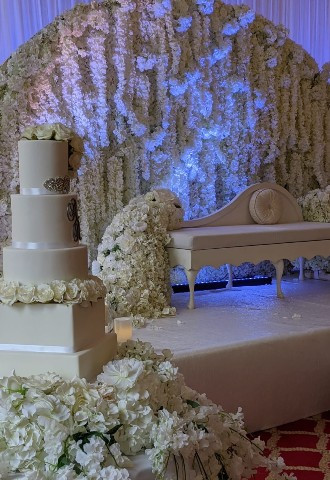 The Banqueting Hall set up with elegant floral decor and a flower wall at The Adelphi Hotel Liverpool