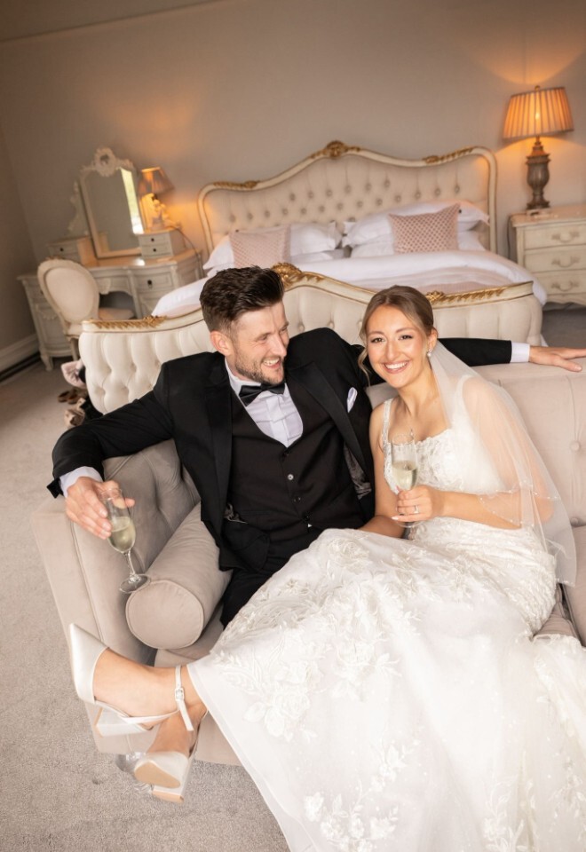 Bride and Groom sat in the Glewstone Court Honeymoon Suite