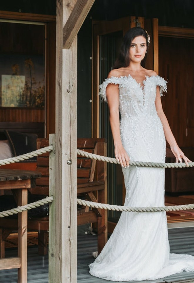 Brides stood on Veranda looking at the view of the Chilterns Hills near wallingford
