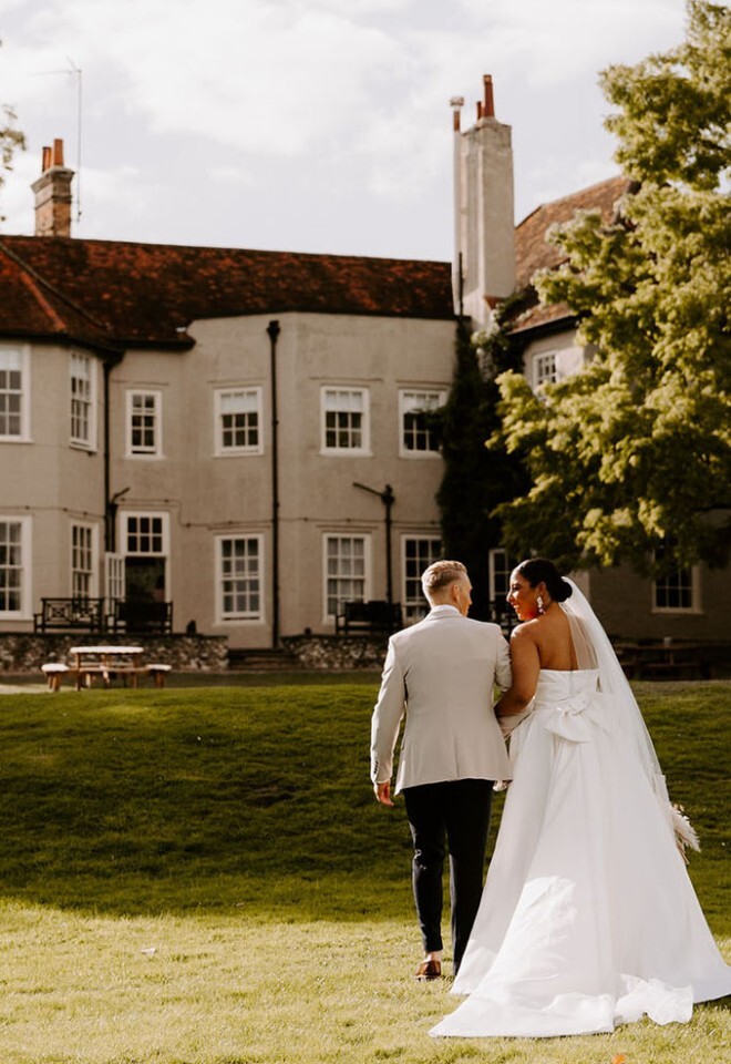 Bride and groom by back of house at That Amazing Place Essex wedding venue