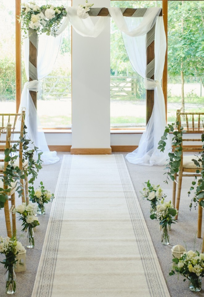 edding ceremony setup at Briar House Barns barn wedding venue in Rotherfield, East Sussex