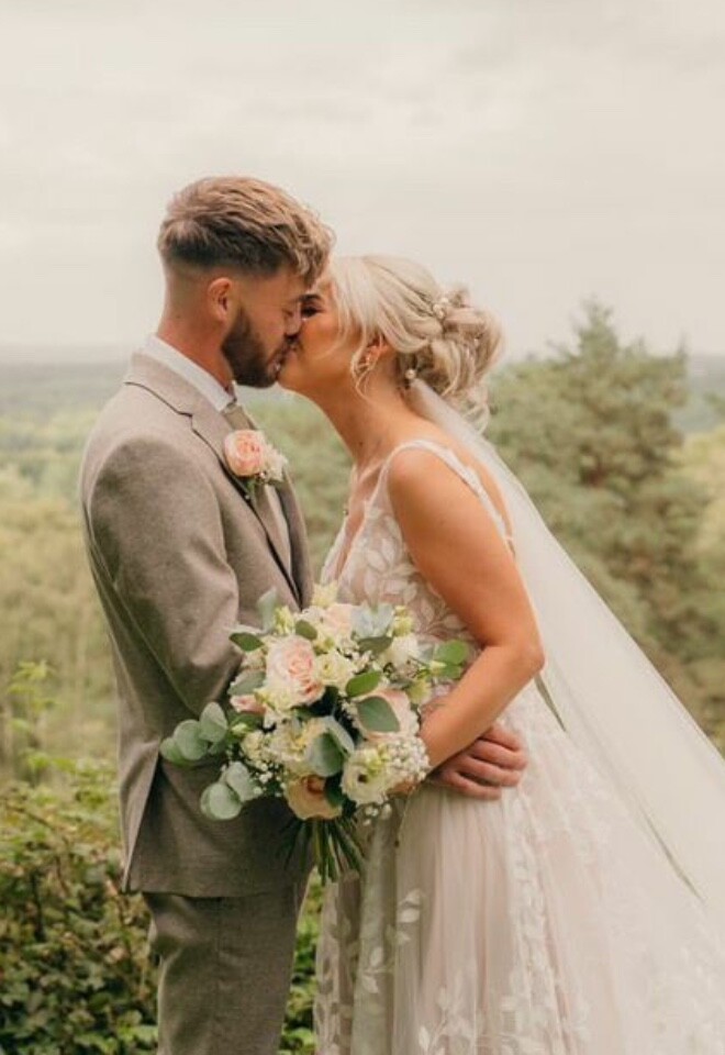 Bride and groom first kiss. 