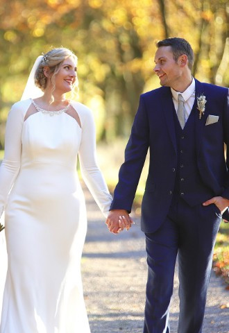 bride & groom walking hand in hand by SMD Wedding Photography
