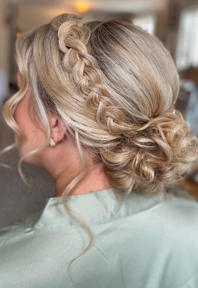 Bridesmaid updo featuring a Dutch braid 