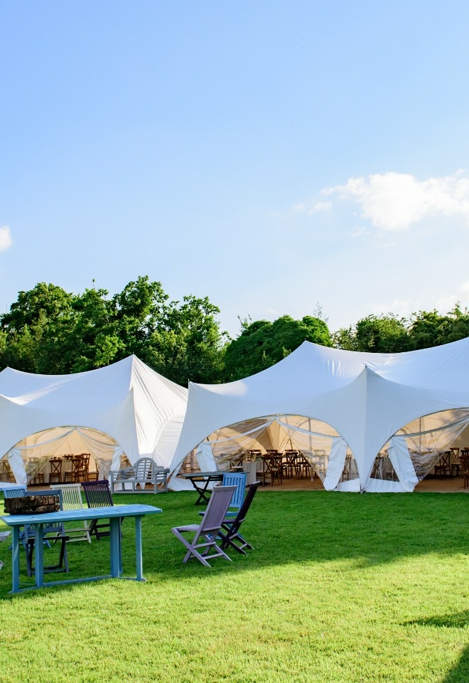 Capri marquee set up in the grounds at Monkton Barn wedding venue near Marlow