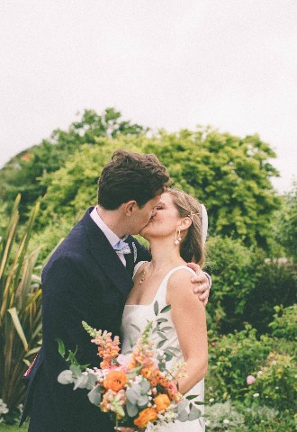 Celebrating their newly married announcement with a kiss. Celebrant led ceremony written by Sally 