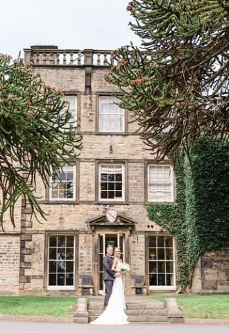 Bride and Groom hugging outside Mosborough Hall Hotel