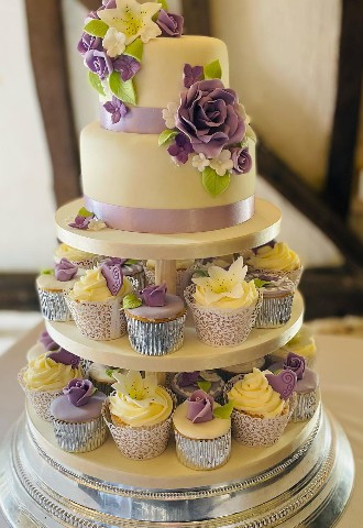 Cup cake wedding cake with one tier and cupcakes in  lilac and silver made by Celebration Cakes by Catherine Scott in Oxfordshire