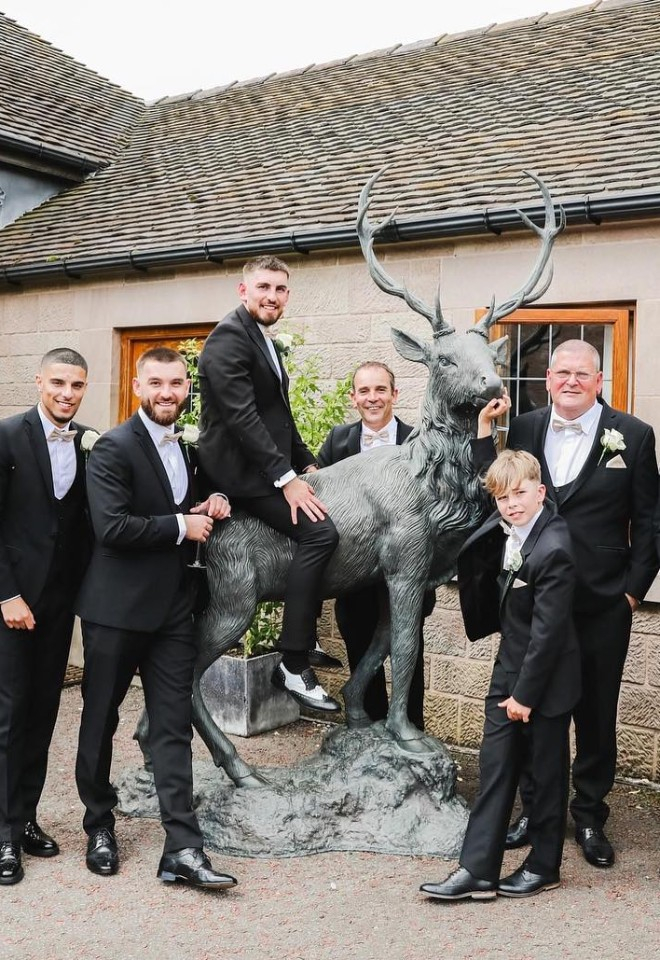Heaton House wedding groom sat on the stag with groomsmen
