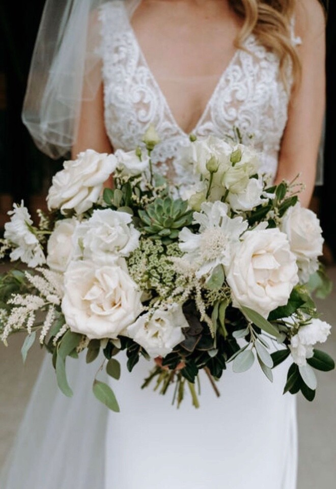 White & green bridal bouquet including roses, peonies and succulents 