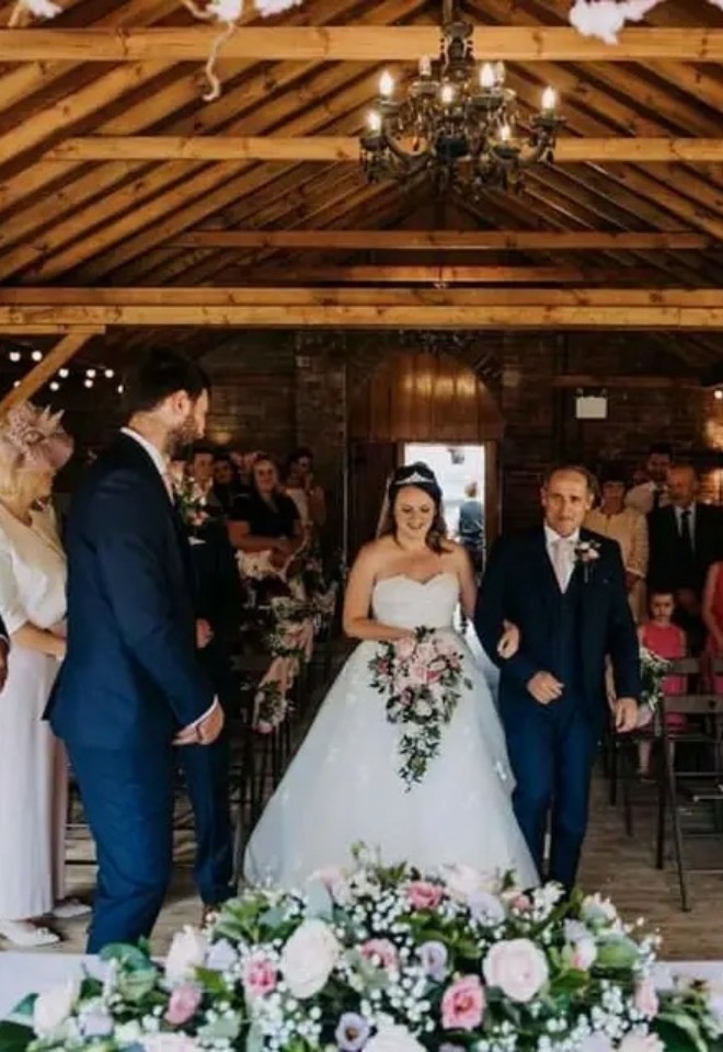 bride walking down isle at Elmhay Park