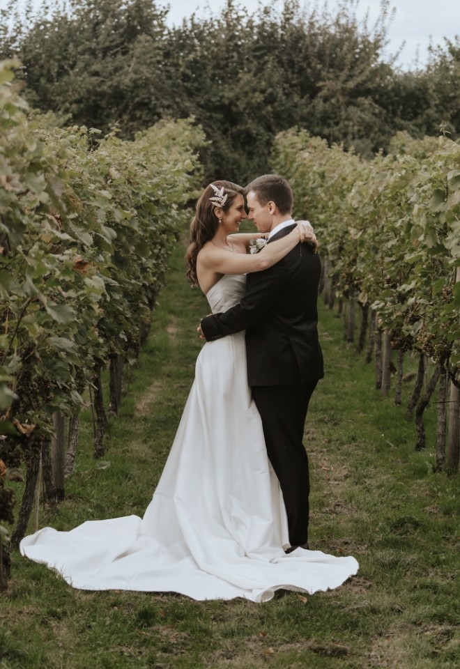 Couple photos in the vineyard at Copdock Hall wedding venue Suffolk