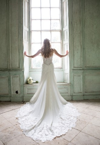Bride looking out of window