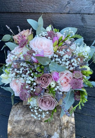 blush and dusky pink bridal bouquet with roses and babys breath with light green foliage by ann laing flowers, harwell, oxfordshire