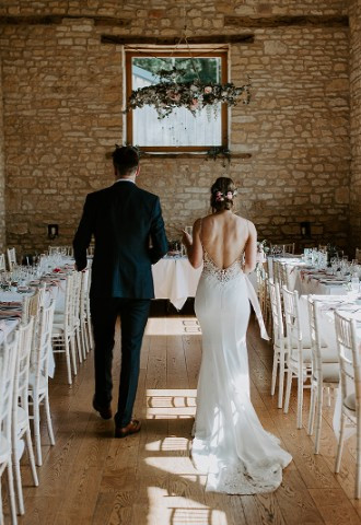Couple inside the Barn at Upcote on wedding day