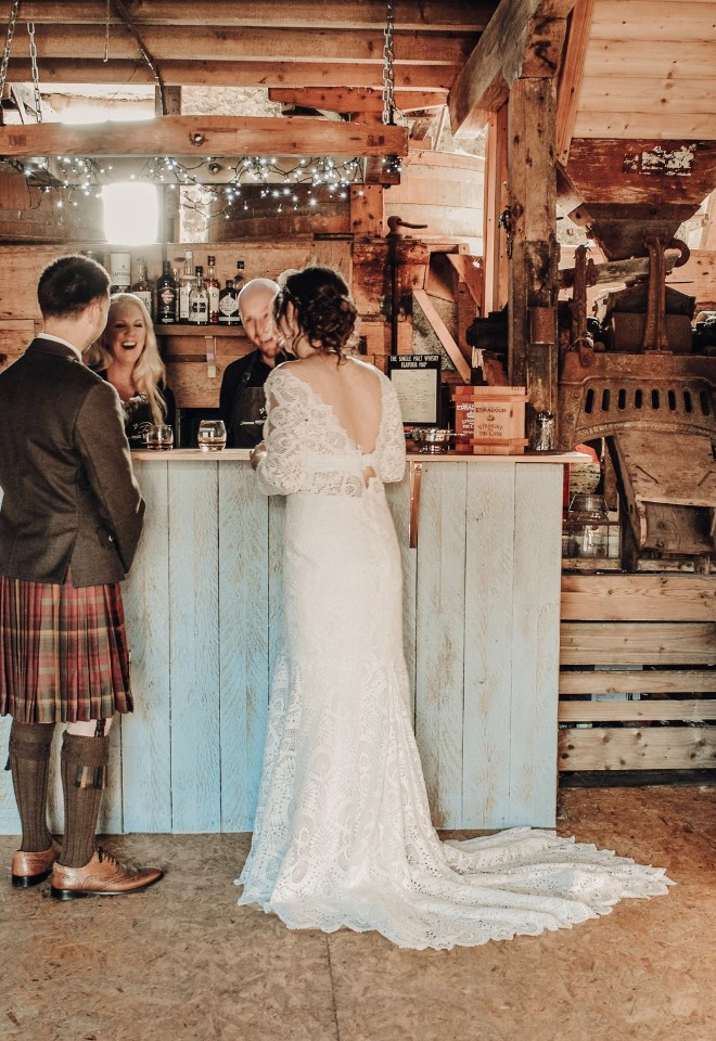 Inside the Mill building, surrounded by all the original features, stood at the bar. 