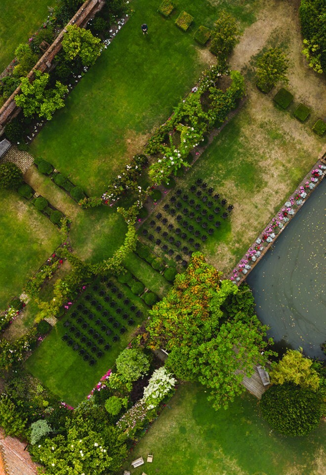 Ariel shoot of the rose garden set for a ceremony, whimsical setting for the perfect outdoor ceremony