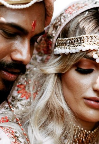 Bride and groom pose for their wedding video