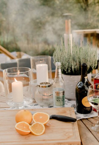 bbq and drinks at sunset at eavestone lake luxury glamping site