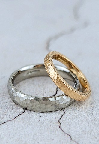 Matching wedding rings for bride and groom, both with hammered texture
