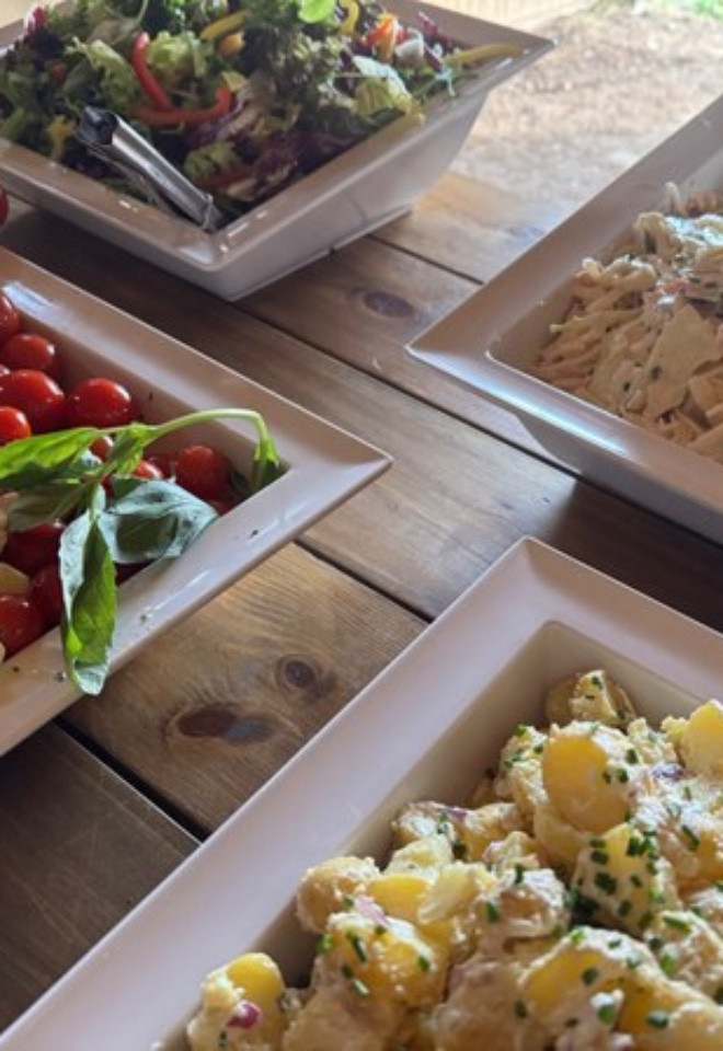 Fresh wedding buffet with homemade coleslaw, Caprese salad, potato salad and mixed green salad in Lancashire