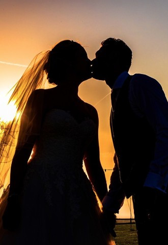 Sunset wedding photograph by Rick Dell Photography