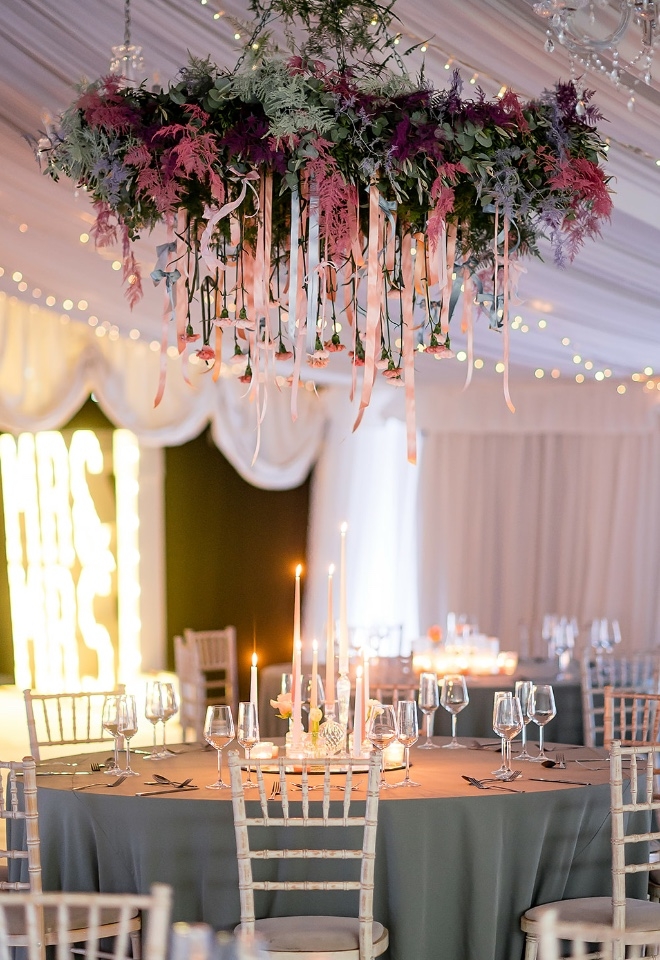 A beautiful pastel hanging floral and foliage chandelier