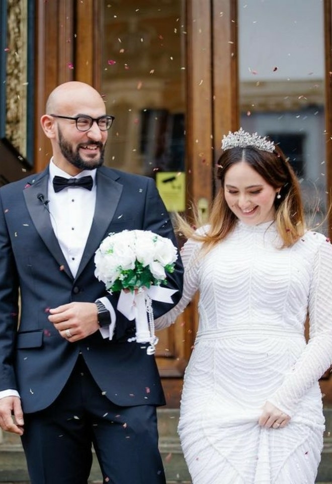 Confetti photo of bride and groom outside Ipswich Town Hall