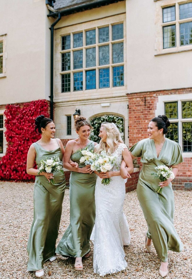 A bride and bridesmaids celebrating at a country wedding venue in Northamptonshire