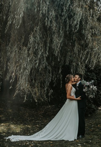 Wedding couple in the grounds at Widbrook Grange - a boutique wedding venue in Wiltshire