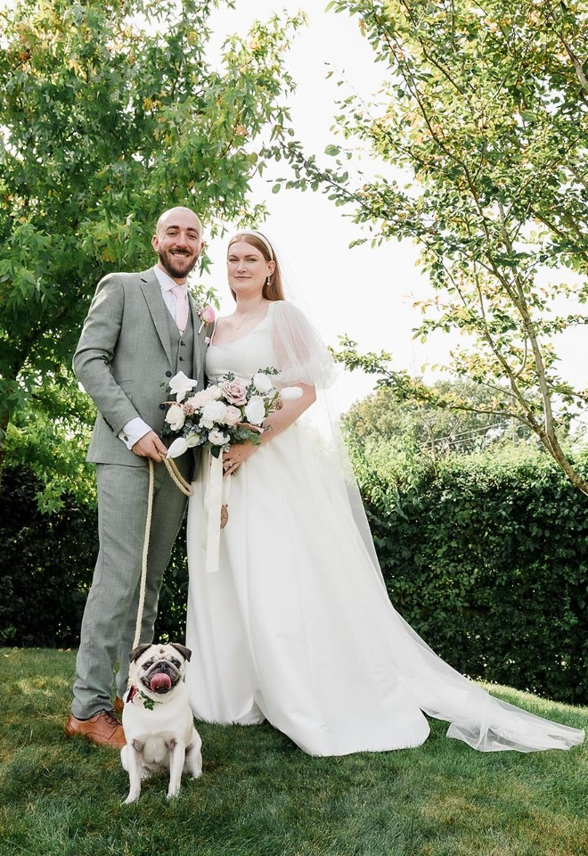 manor hill house weddings worcestershire with bride & groom and their pet pug celebrating their wedding day
