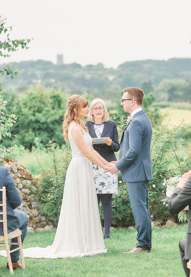 Bride and Groom holding hands at Barn Drift Weddings by Stuart Wood
