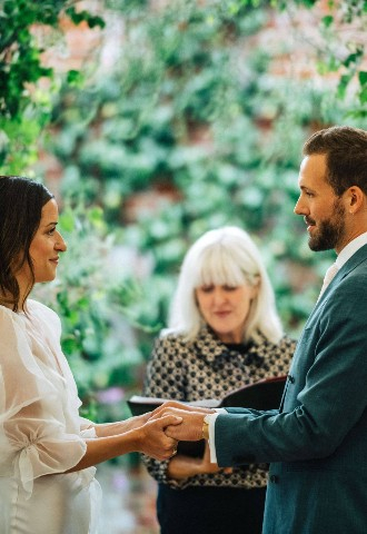 Bride and groom sharing personal vows 