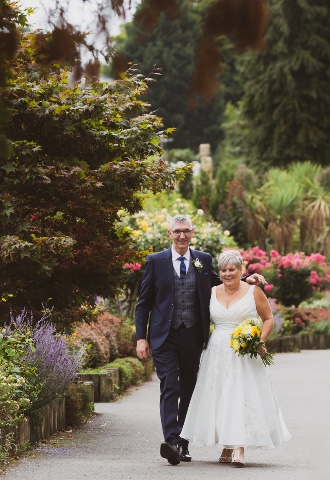 Great Malvern wedding couple walking in Priory Park. 