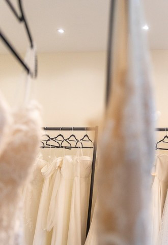 Wedding dresses hanging up, Your Story logo