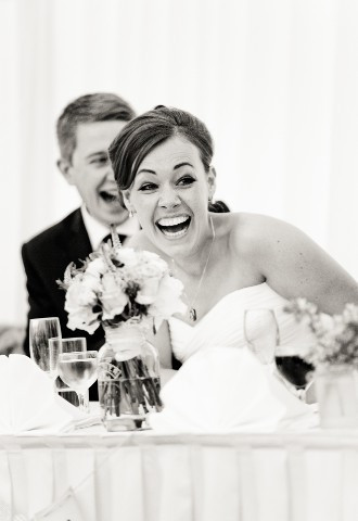 Bride enjoying the speeches