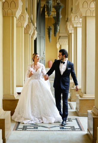 Bride and Groom walking through the Palace Downtown