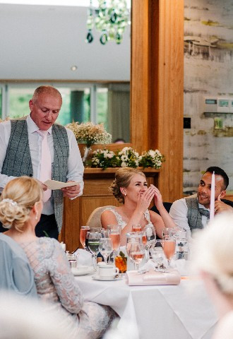 Wedding speeches being read at Gibbon Bridge Hotel, Preston