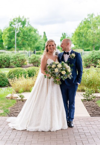 Bride and groom in the grounds at East Sussex National