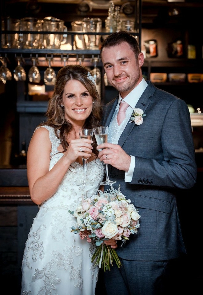 Couple toasting their wedding at the Crown & Thistle