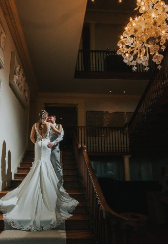 Howsham Hall staircase bride & groom