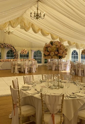 Hire Heaven marquee wedding decor table centre pieces flowers chair sashes