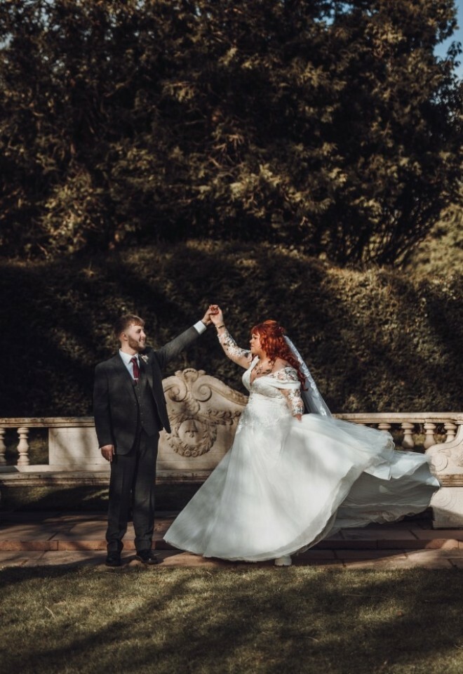 Couple by the stone bench