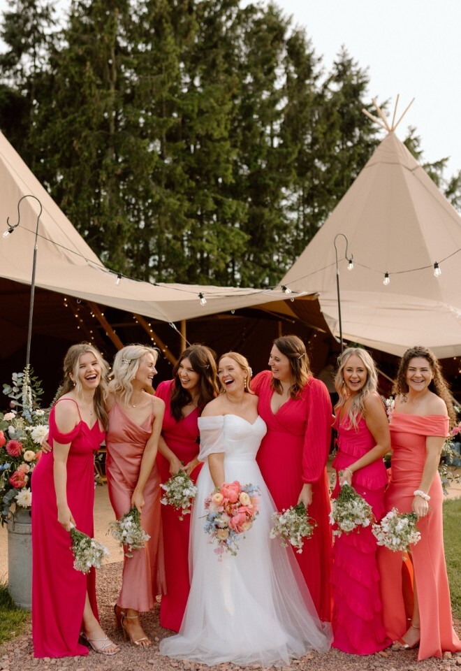 bride with bridesmaids at tipi wedding in Herefordshire